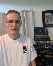 Alex at a home DJ setup: a PLAYdifferently Model 1.4 mixer and a laptop with a course plotted in Spektra